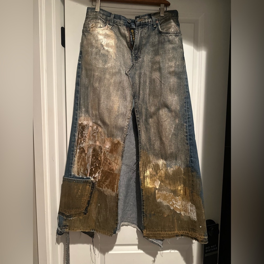 Upcycled denim skirt embellished with gold foil and paint.